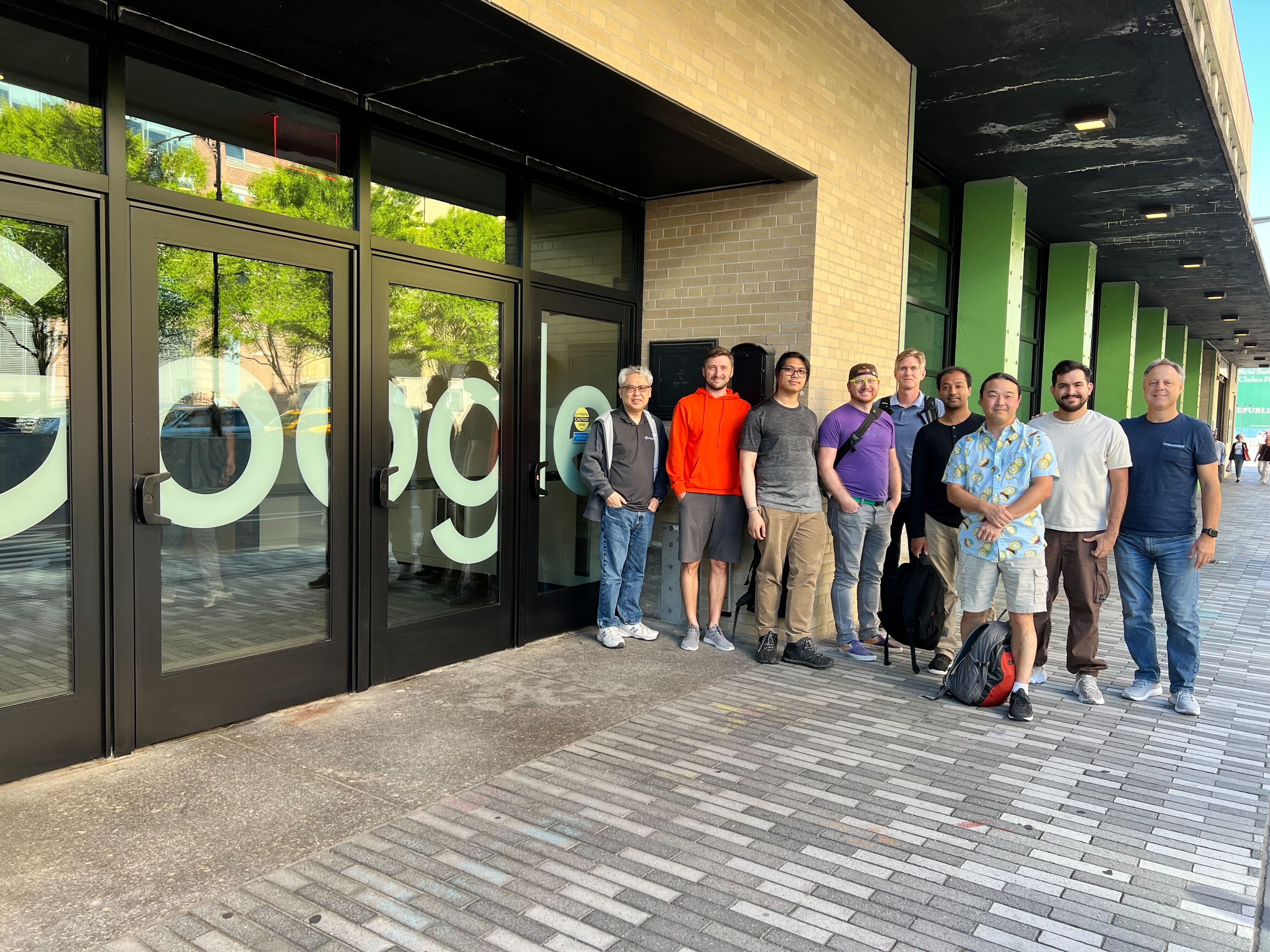 A group photo of the InfinyOn team standing in from of the entrance of the NYC Google office at Pier 57